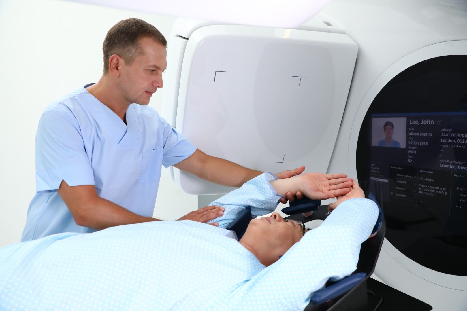 Clinician setting up a patient on a RT machine