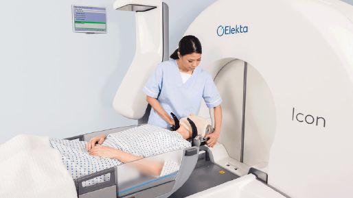 Leksell Gamma Knife Icon with a patient on the table and a female nurse