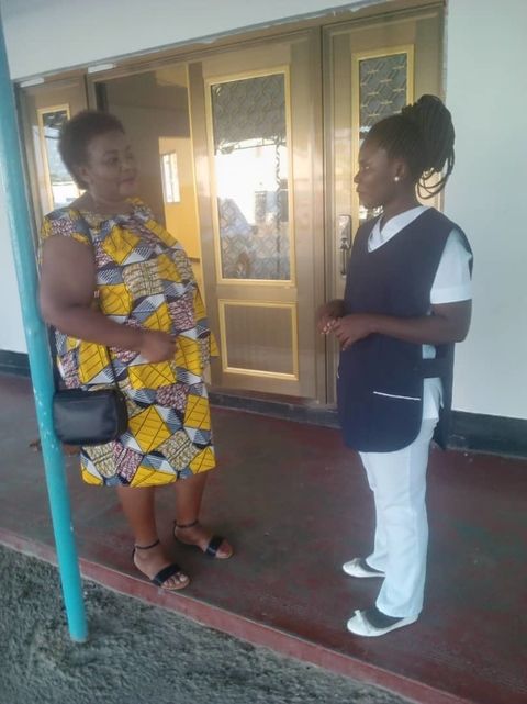 Salome Mwanakatwe with a radiographer at the main hospital in Kitwe