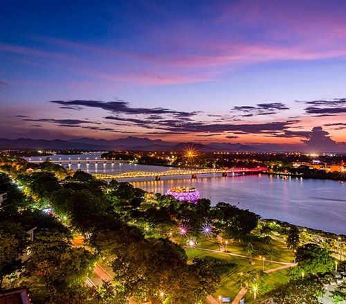 Huong River, and Trang Tien Bridge, the most beautiful bridge in Hue, Vietnam Unesco World Heritage Site.