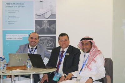 Dr. Bamajboor (right) and two Elekta representatives at the ICRM 20 at King Faisal Specialist Hospital in Riyadh
