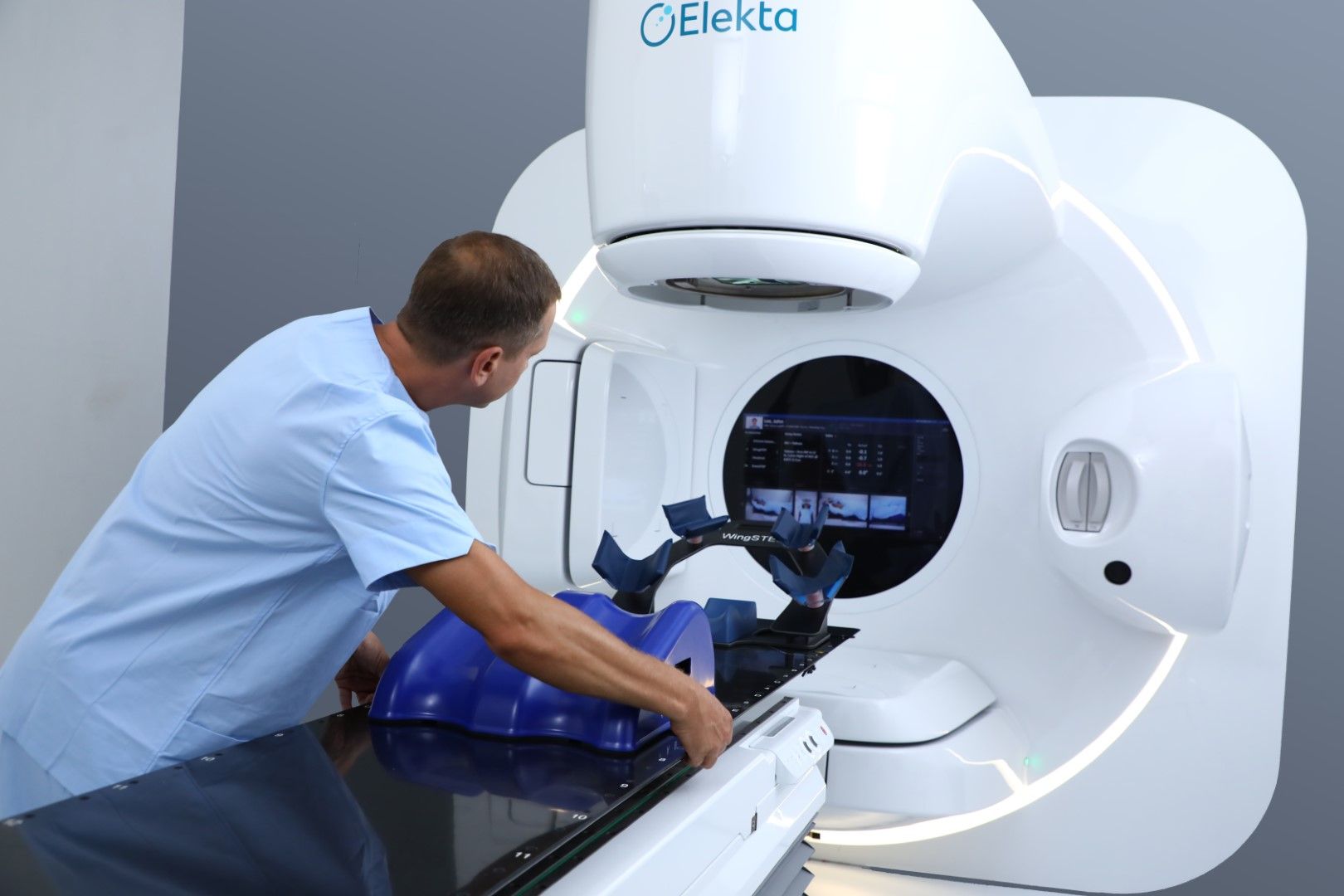 Clinician setting up RT machine for use