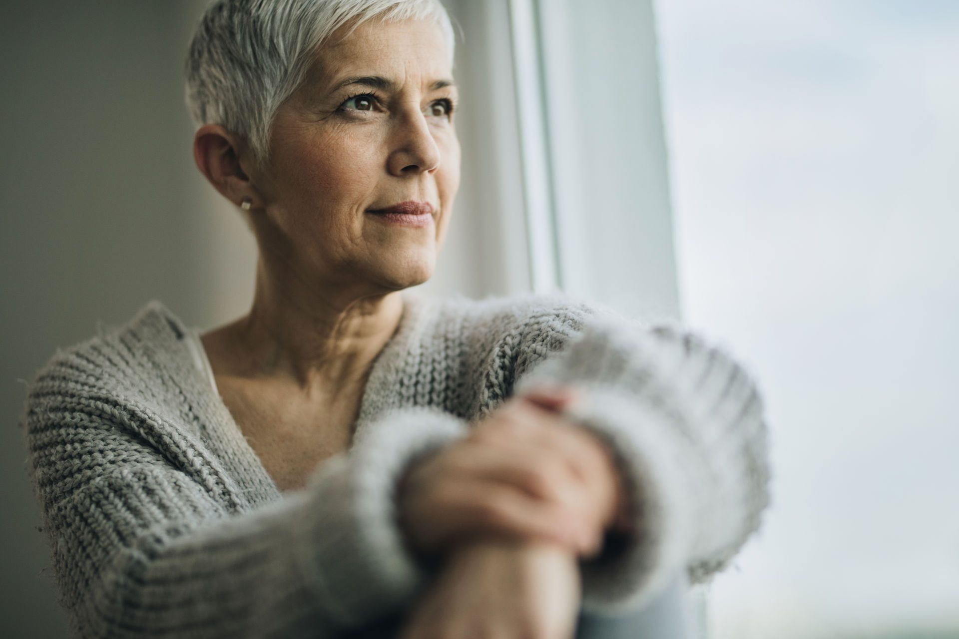 Woman Looking out Window