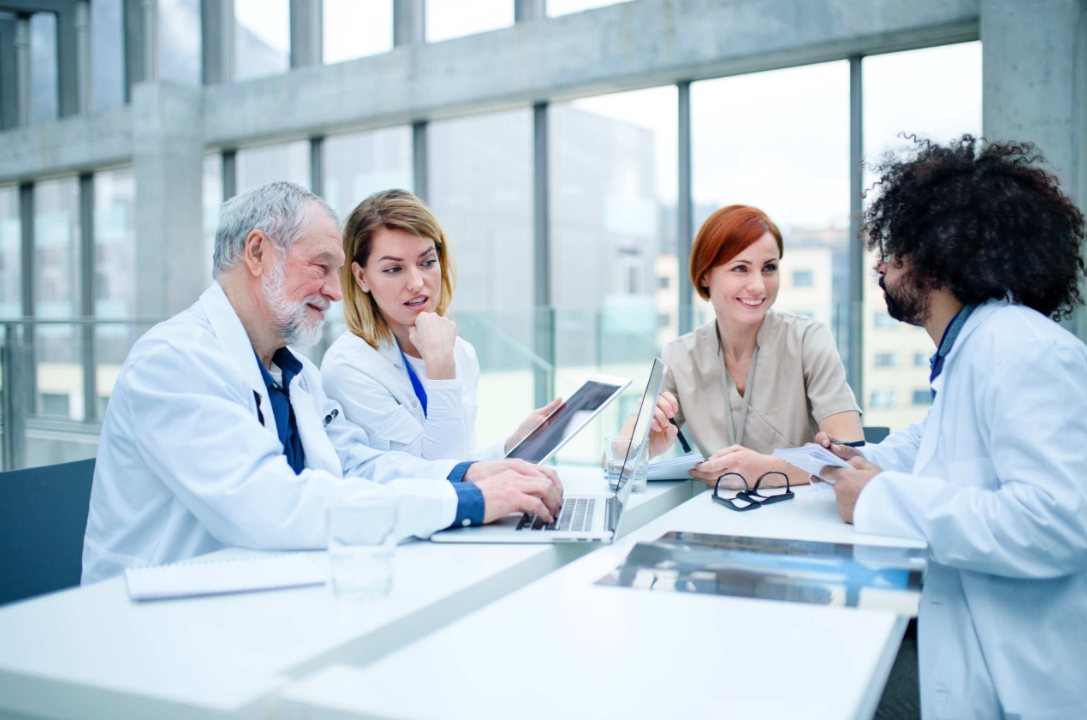 Clinical team discussing optimisation in a meeting